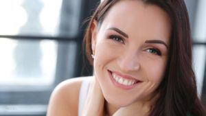 Smiling Model with White Healthy Teeth