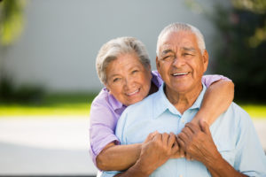 Loving senior couple hugging and posing